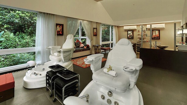 A modern bathroom with a large window, a sink, and a toilet.