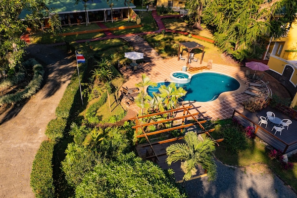 Outdoor pool, open 7 AM to 9:00 PM, pool loungers