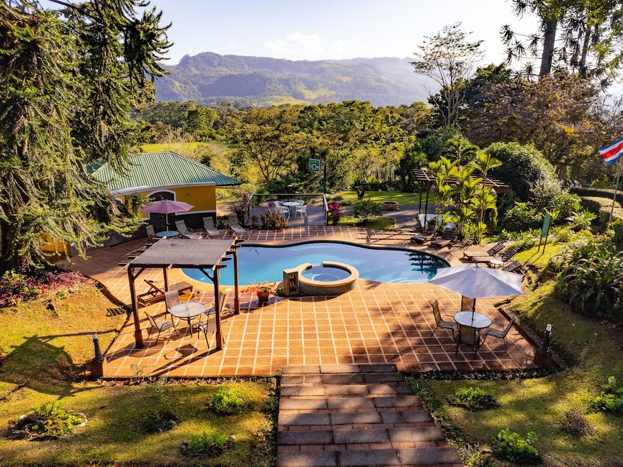 Outdoor pool, open 7 AM to 9:00 PM, pool loungers