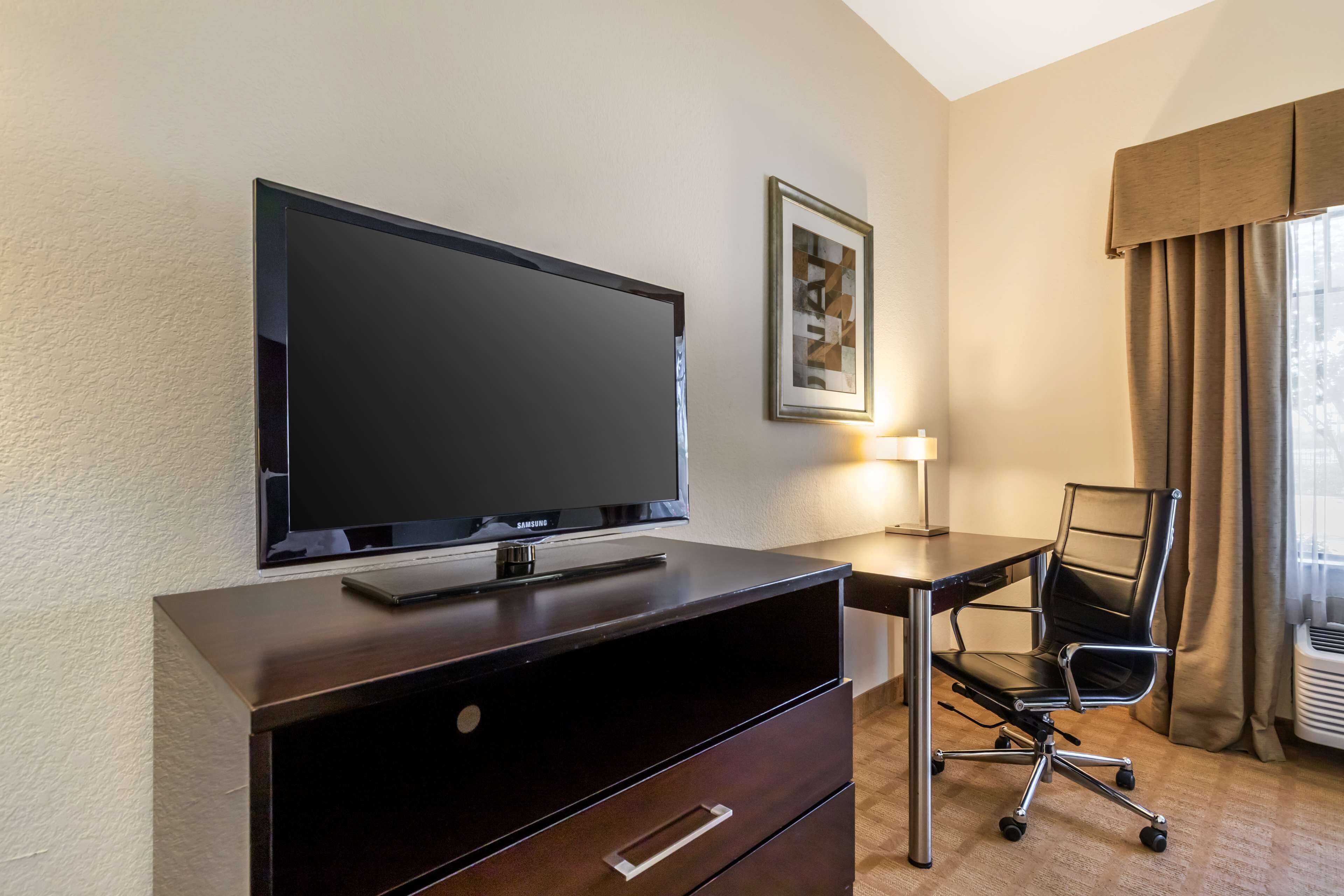 desk, laptop workspace, iron/ironing board, rollaway beds