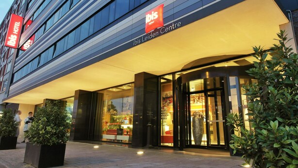 The exterior of the ibis hotel with a modern design, featuring large glass windows and a prominent entrance. - ibis Leiden Centre (Leiden)