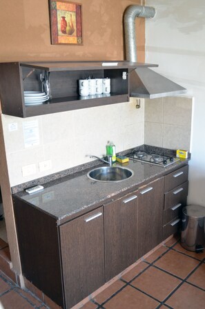 Fridge, coffee/tea maker, cookware/dishes/utensils