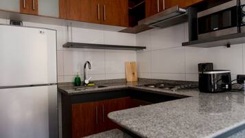 Standard Apartment | Private kitchenette | Full-size fridge, microwave, oven, stovetop