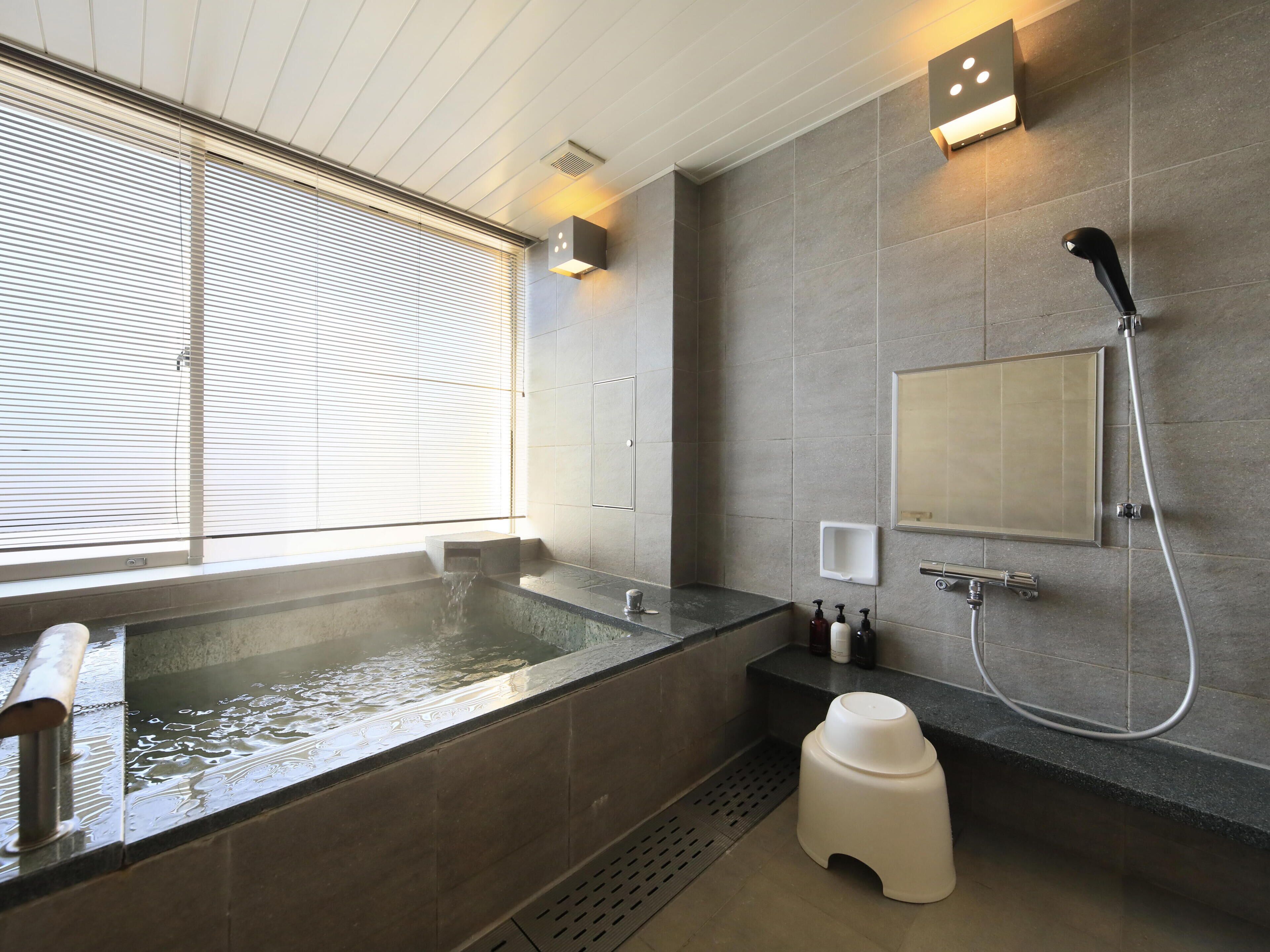 separate bathtub and shower, hair dryer, bathrobes, slippers