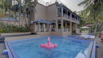 2 indoor pools, 2 outdoor pools, open 8:00 AM to 8:00 PM, pool umbrellas