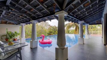 2 indoor pools, 2 outdoor pools, open 8:00 AM to 8:00 PM, pool umbrellas
