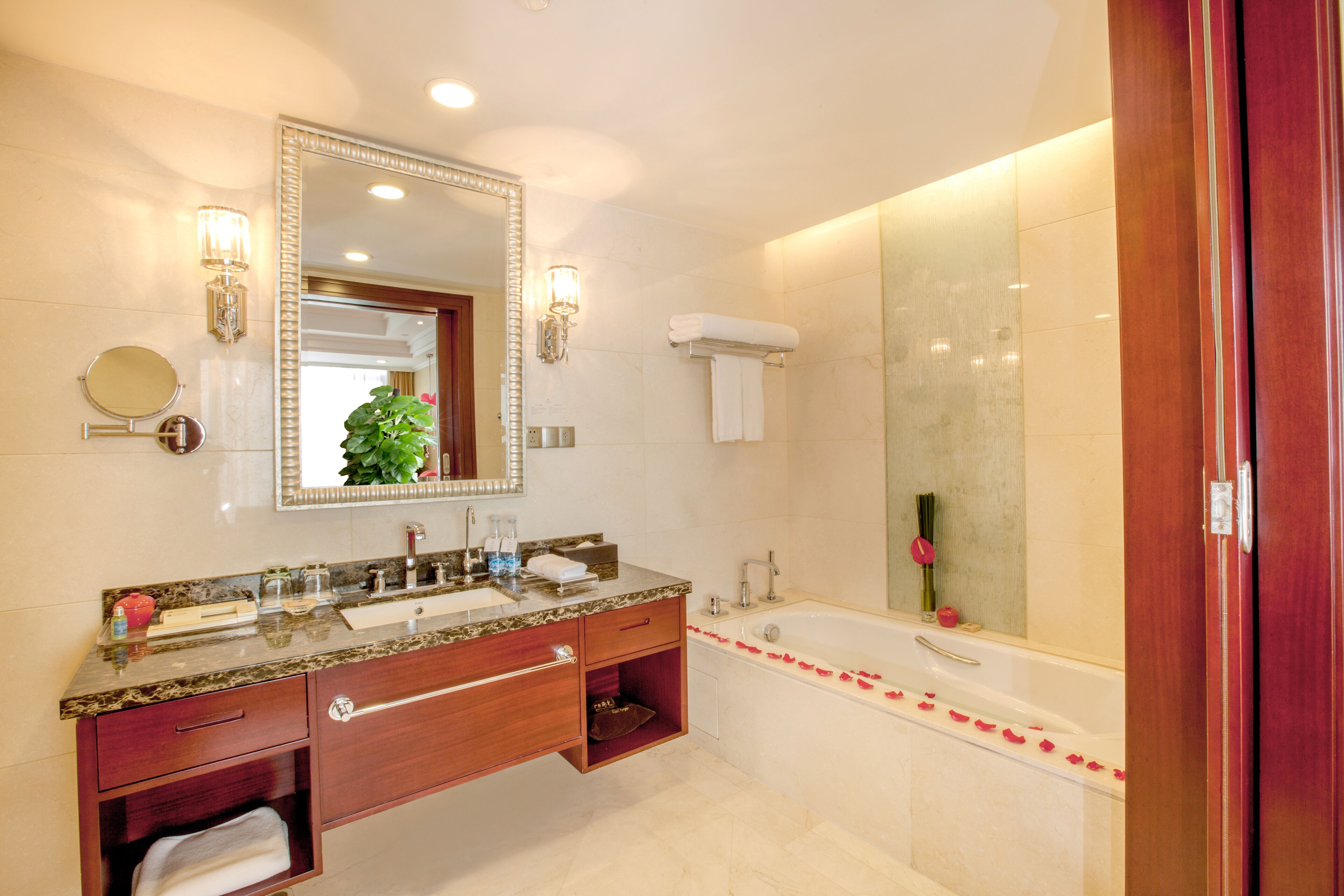 deluxe suite (facebook, twitter available inroom) | bathroom | combined shower/bathtub, deep-soaking bathtub, free toiletries
