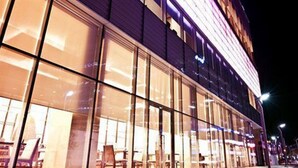 A modern building with large windows and a flat facade. - Stanford Hotel Seoul (Seoul)