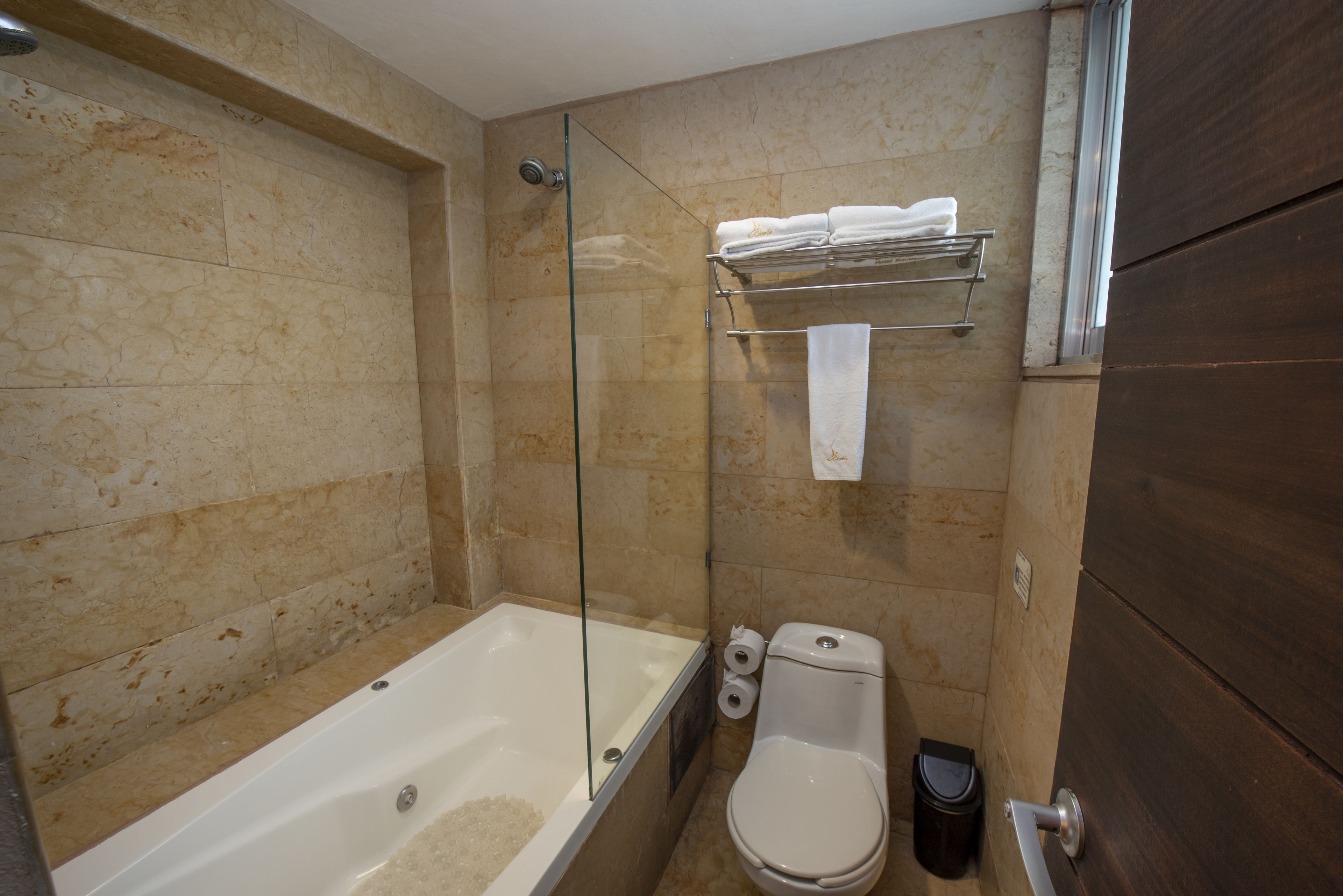 junior suite, 1 queen bed | bathroom | shower, free toiletries, hair dryer, towels