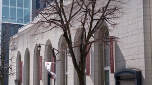 A building with arched windows and banners. - Matsumoto Marunouchi Hotel (Matsumoto)