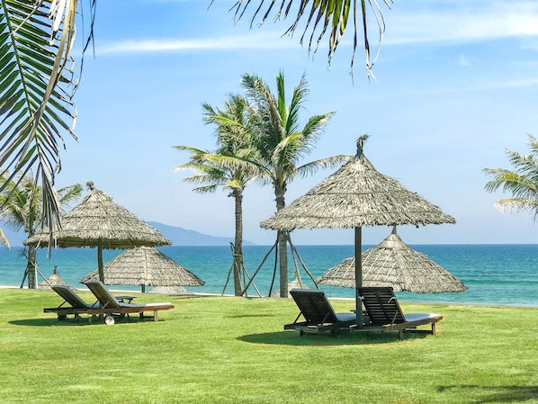 Private beach, white sand, sun loungers, beach umbrellas