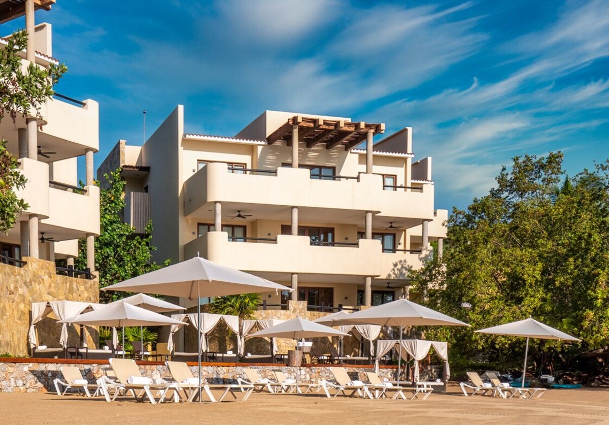 beach chairs on the beach at Celeste Beach Residences, one of the best resorts in Huatulco Oaxaca Mexico