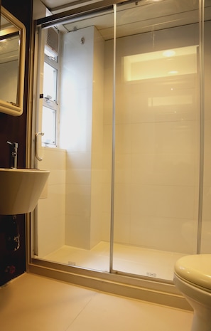 Shower, hair dryer, slippers, towels