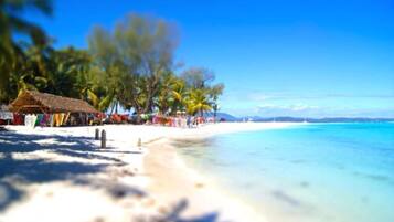 On the beach, sun loungers, beach umbrellas, beach towels