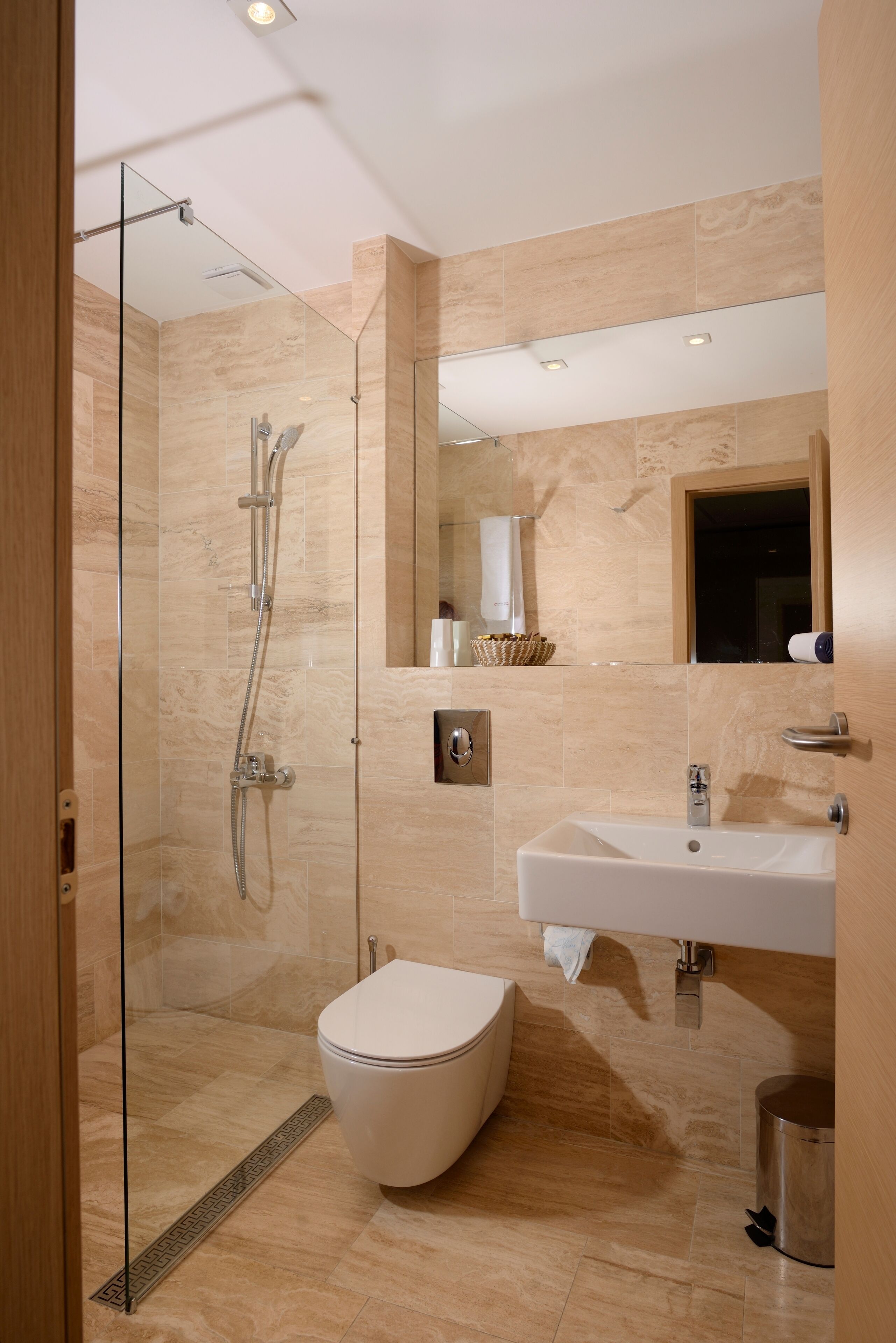 shower, designer toiletries, hair dryer, towels