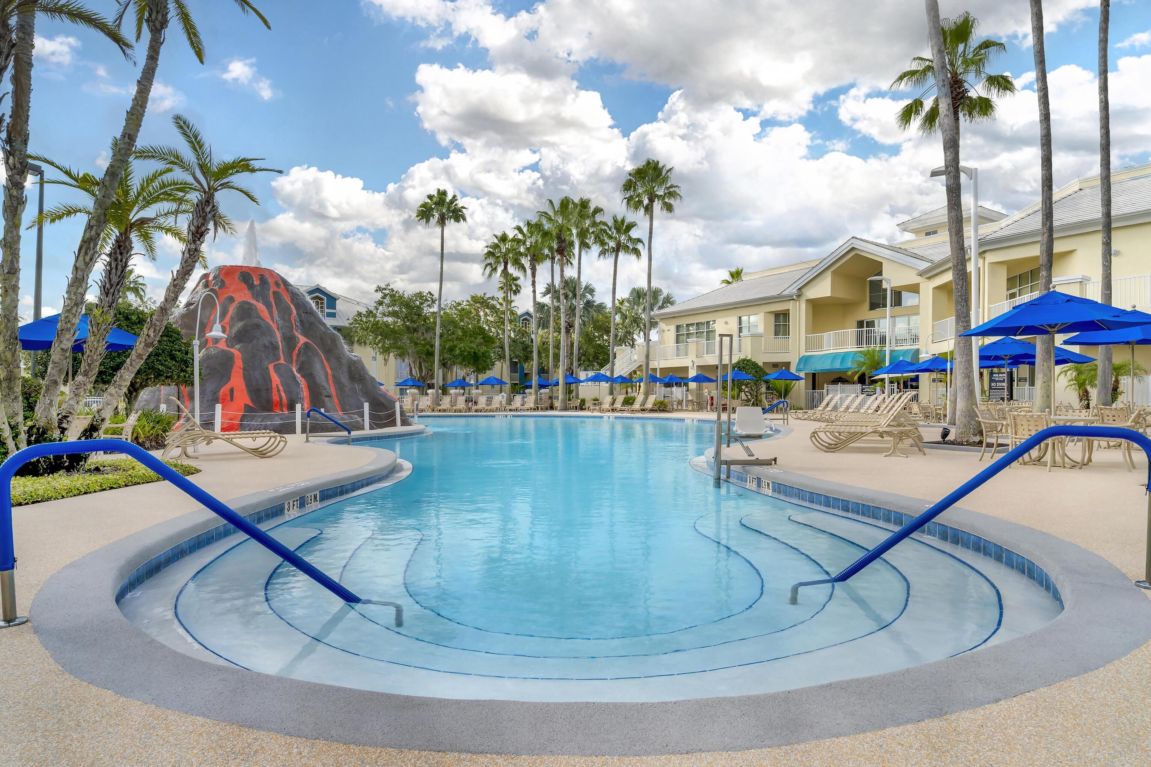 Outdoor pool, open 7:00 AM to 11:00 PM, pool umbrellas, sun loungers