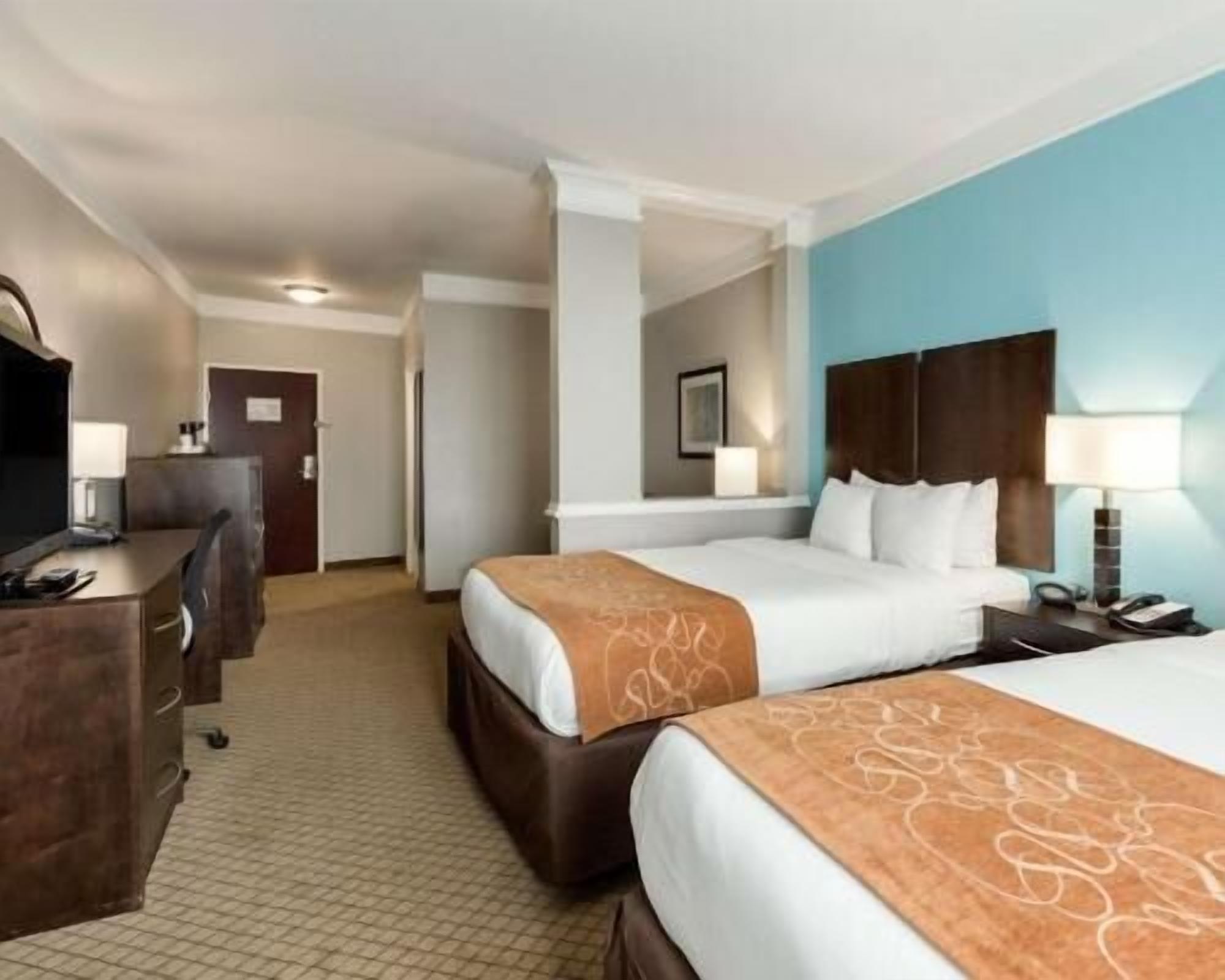 Premium bedding, desk, laptop workspace, iron/ironing board