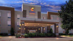 A Comfort Suites hotel with a covered entrance, brick facade, and a clear sky. - Comfort Suites at Katy Mills (Katy)