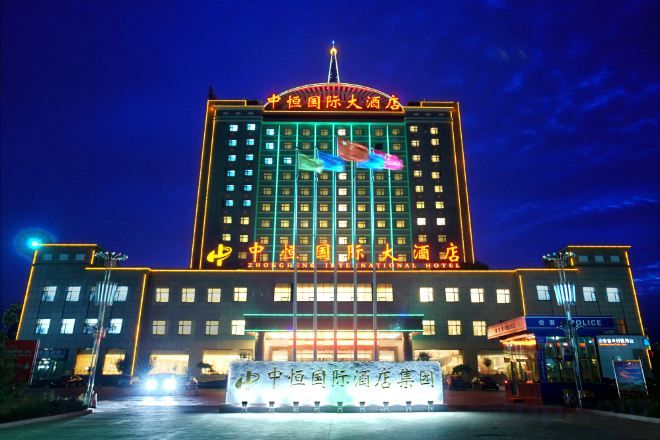 A large hotel building with multiple floors and a prominent entrance.