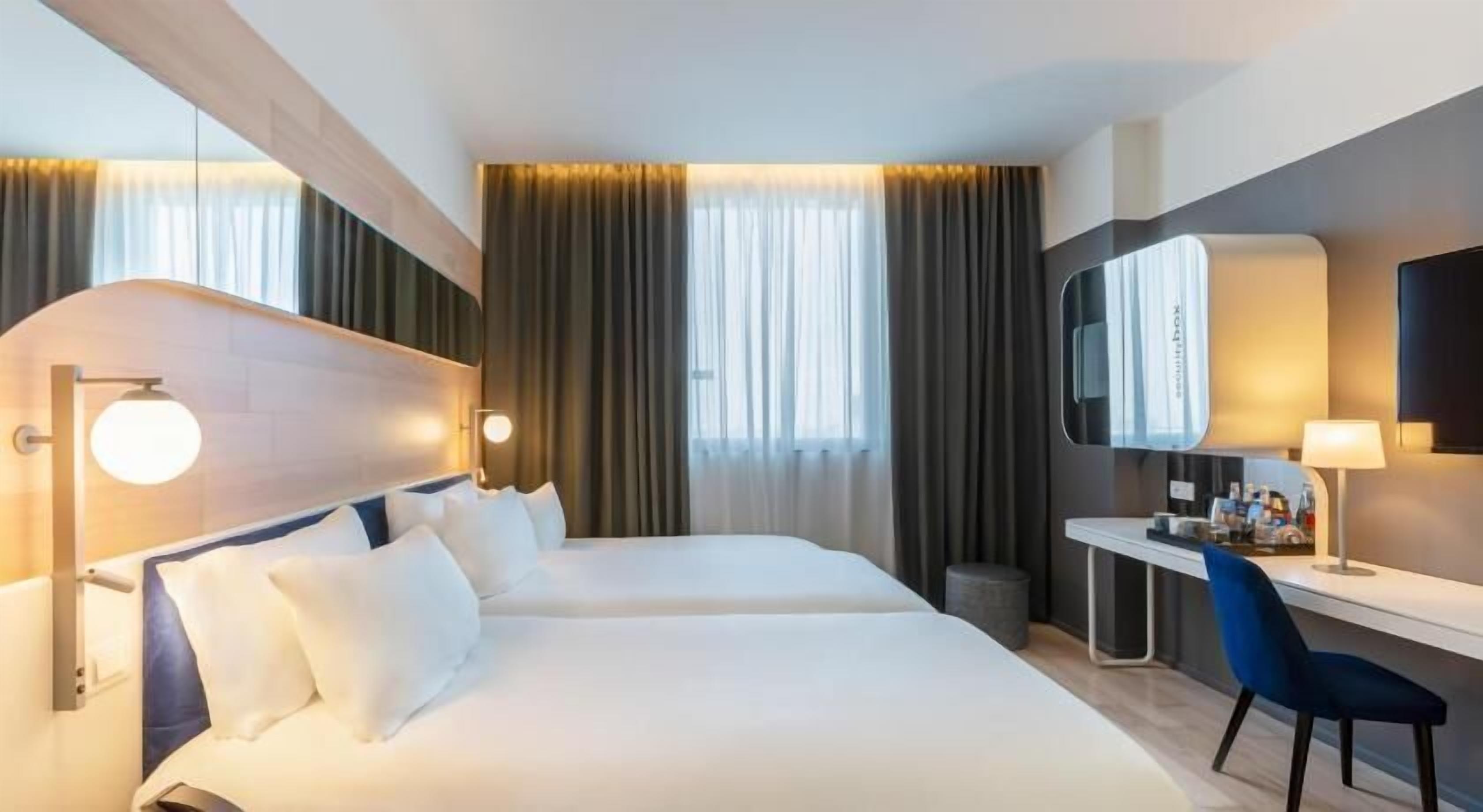 Premium bedding, down comforters, minibar, in-room safe