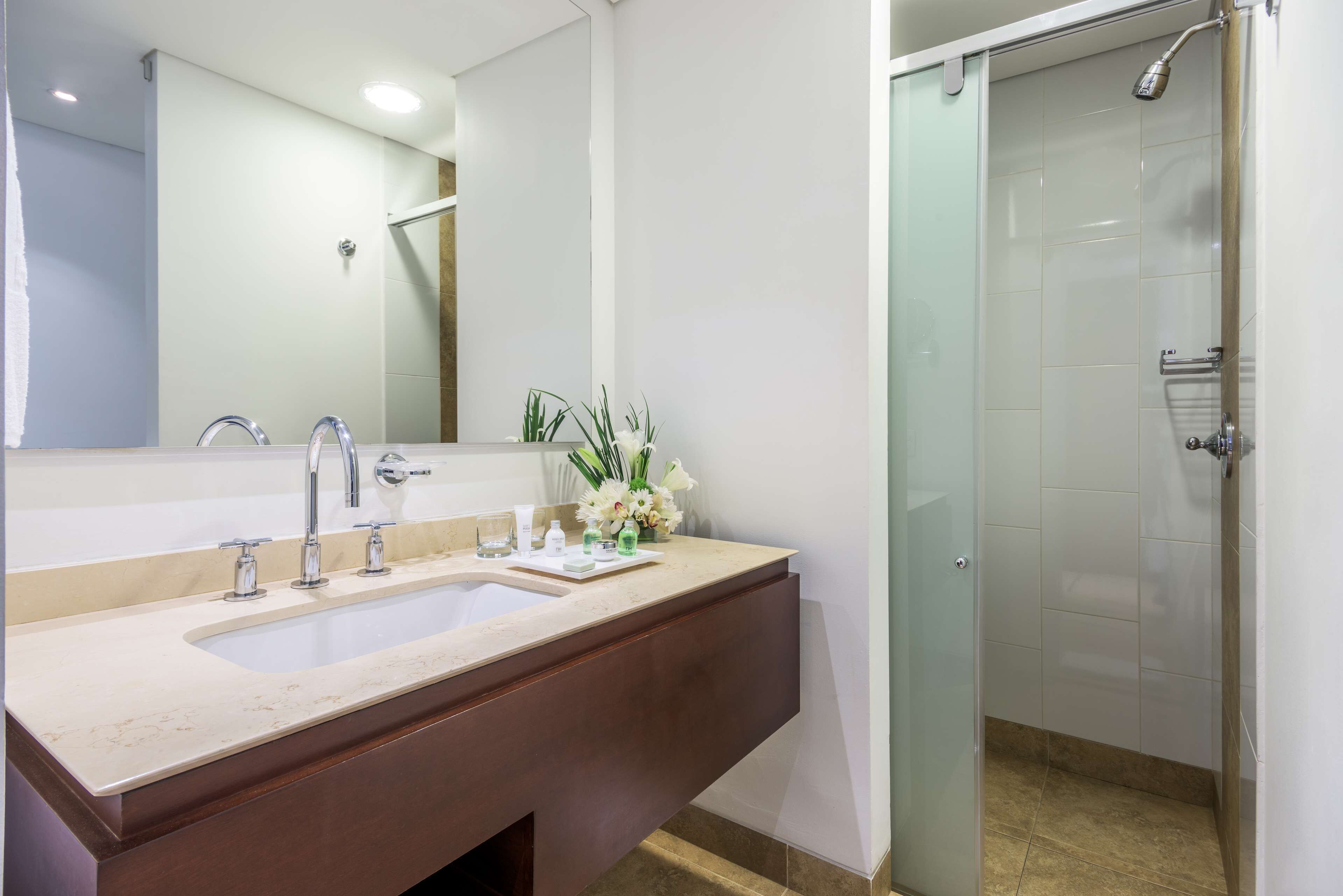 superior double room | bathroom | shower, rainfall showerhead, eco-friendly toiletries, hair dryer