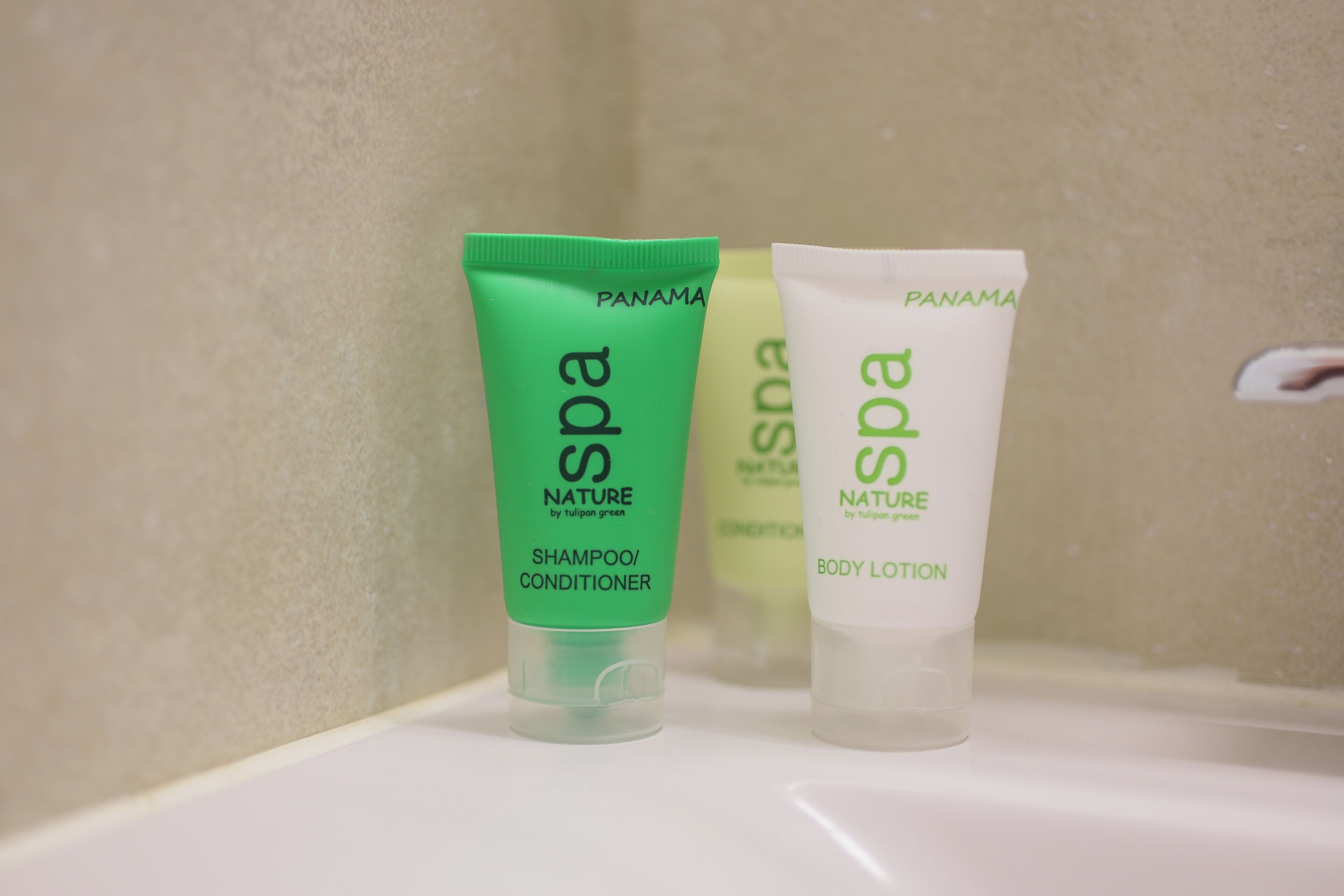 Three spa products on a shelf.