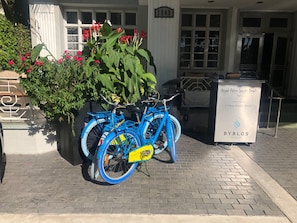 A blue bicycle parked in front of a building with a sign reading "Royal Palm South Beach" and "BYBLOS". - Royal Palm South Beach Miami, a Tribute Portfolio Resort (Miami Beach)