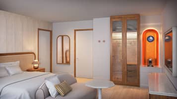 A bedroom with a bed, bedside table, lamp, and a mirror.