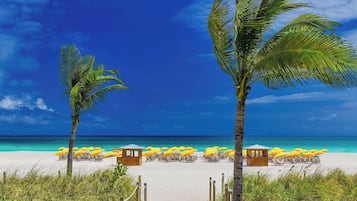 On the beach, beach cabanas, sun loungers, beach umbrellas