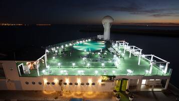 Indoor pool, outdoor pool, pool umbrellas