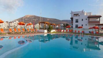Indoor pool, outdoor pool, pool umbrellas