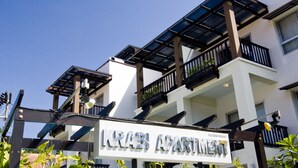 A multi-story building with balconies and a sign reading "KRABI APARTMENT". - Krabi Apartment Hotel (Krabi)
