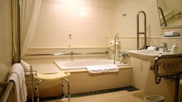 Combined shower/bathtub, deep-soaking bathtub, free toiletries, slippers