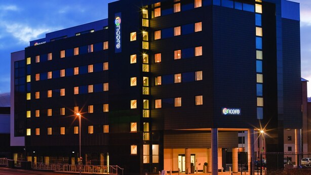 A multi-story hotel with a modern design, featuring a prominent Encore logo. - Ramada Encore by Wyndham Newcastle-Gateshead (Gateshead)