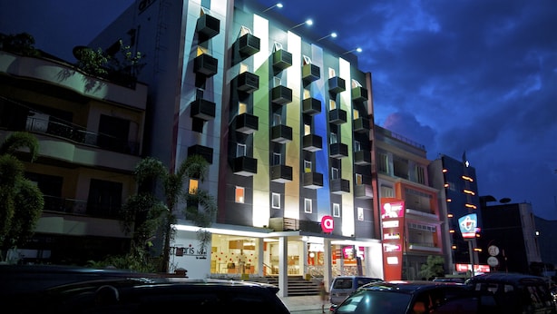 A multi-story hotel with balconies, a prominent 'A' logo, and a staircase leading to the entrance. - Amaris Hotel Ambon (Ambon)