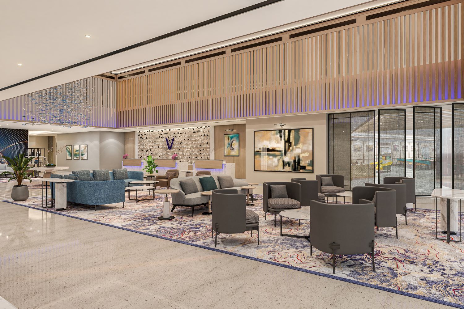 A spacious lobby with a mix of seating areas, a reception desk, and a large window offering a view of the outside.