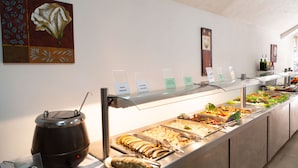A buffet with various food options and a coffee machine. - Tropical (Puerto de la Cruz)
