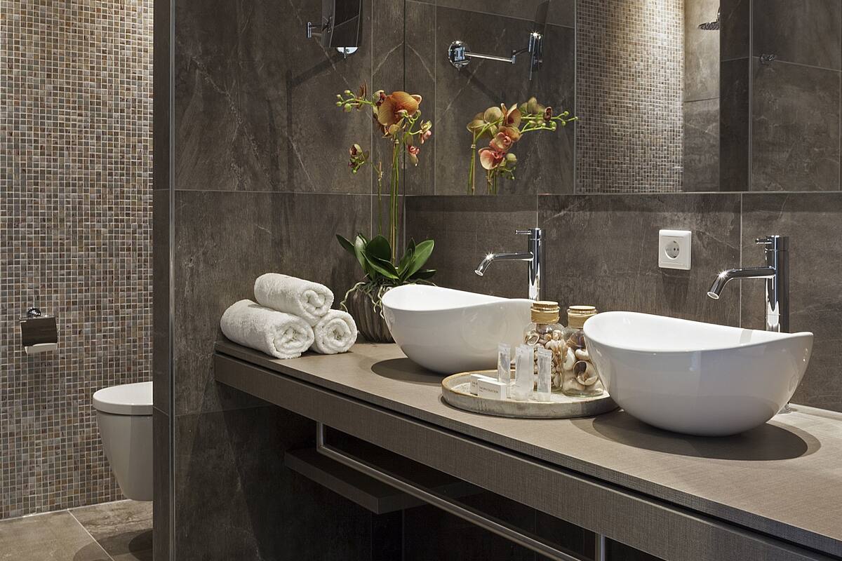 junior suite | bathroom | shower, rainfall showerhead, designer toiletries, hair dryer