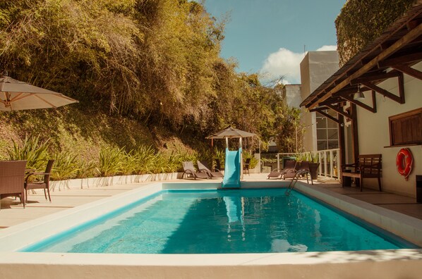Outdoor pool, pool umbrellas, pool loungers