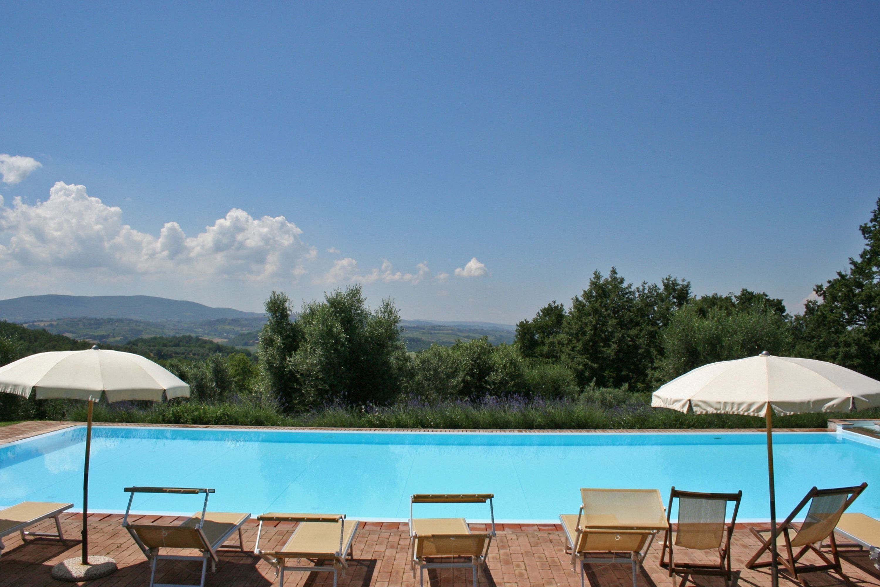 Outdoor pool, pool umbrellas, sun loungers