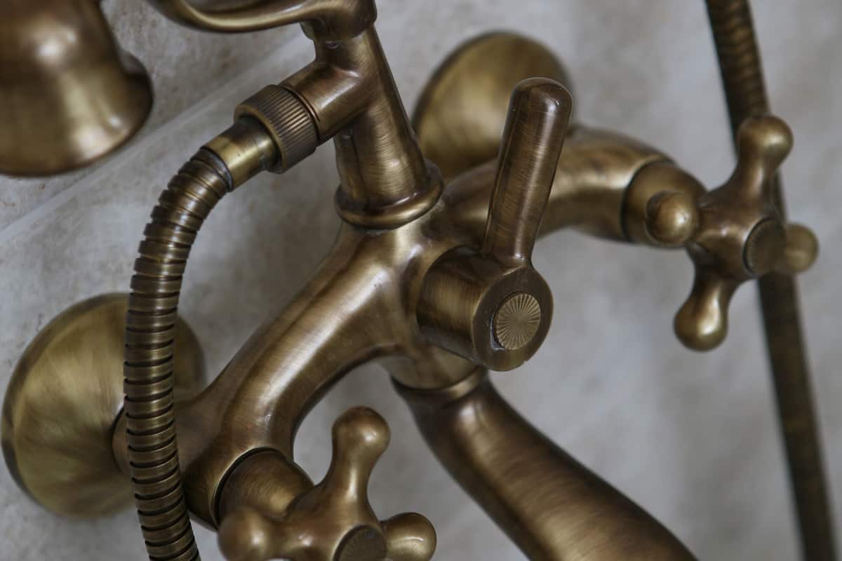 designer toiletries, hair dryer, slippers, towels