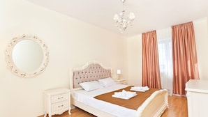 A bedroom with a bed, nightstand, dresser, and a mirror. - Lukyanovsky (Kyiv)