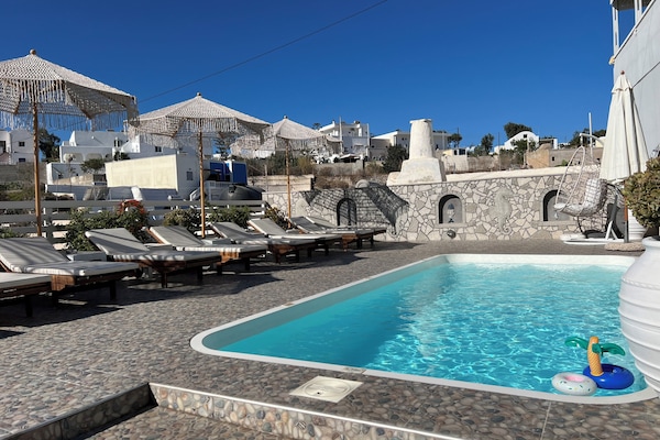 Seasonal outdoor pool, open 9:00 AM to 9:00 PM, pool umbrellas