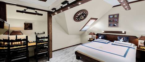 A bedroom with a large bed, a desk, and a chair. There is a clock on the wall and a window with a view of the sky.