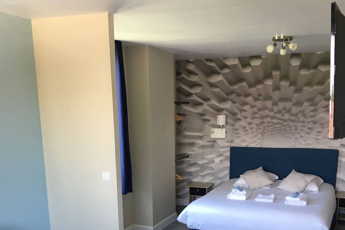 Habitación Deluxe | Escritorio y espacio para trabajar con laptop