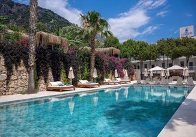Seasonal outdoor pool, open 9:00 AM to 7:00 PM, pool umbrellas