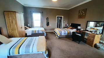 Family Room, Partial Sea View | In-room safe, desk, soundproofing, iron/ironing board