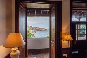 Deluxe Suite | Living area | Flat-screen TV, DVD player