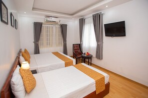 Family Room, Smoking, City View | Minibar, in-room safe, desk, laptop workspace - Rendez Vous Hotel (Hanoi)