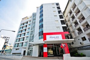 A modern building with a prominent red and white entrance labeled "ASHLEE HEIGHT". - ASHLEE Heights Hotel Patong (Patong)